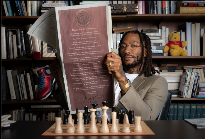 Derrick Rose Reading a newspaper.