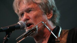 Kris Kristofferson singing a song.