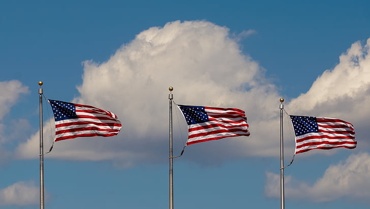 Representative image of three US flags on poles. Photo source: Pickpik.