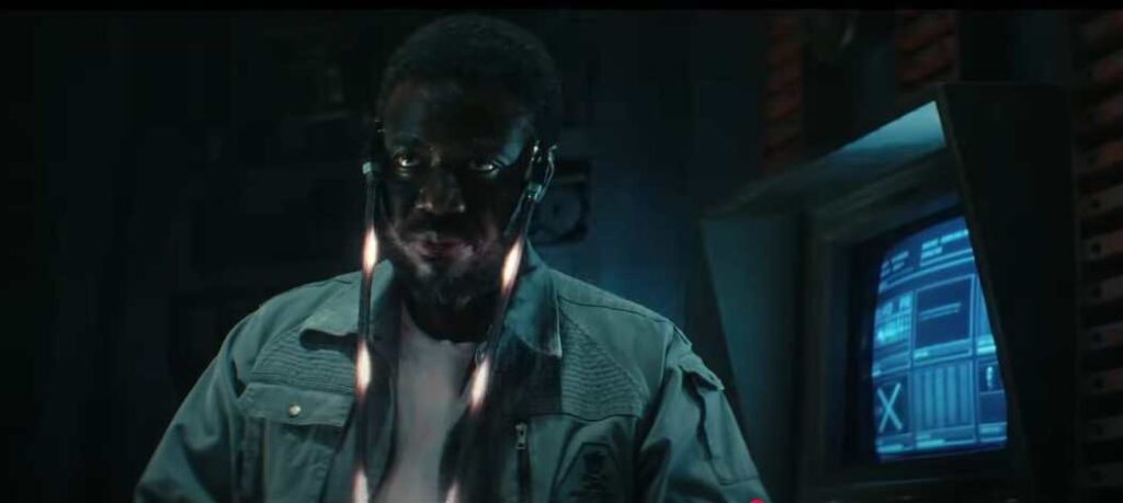A futuristic scene from FX's Alien: Earth showing a person in front of a high-tech interface, hinting at advanced technology and synthetic intelligence.