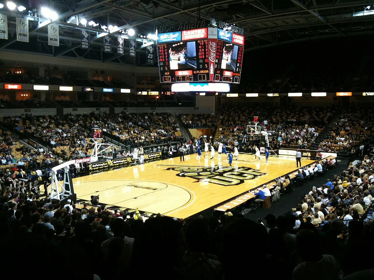 Interior of the UCF Arena basketball venue with seating and court visible under lights