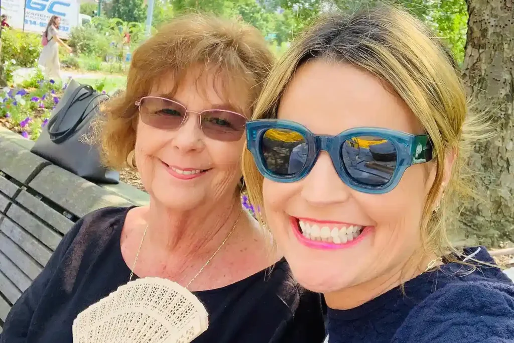 Savannah Guthrie smiling beside her mother Nancy Guthrie in an outdoor family photo later referenced during the investigation into Nancy Guthrie’s disappearance in Arizona.