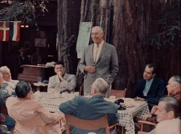 Harvey Hancock speaking to Bohemian Club members at Owl’s Nest Camp in Bohemian Grove in 1967, with Ronald Reagan, Richard Nixon, and Glenn T. Seaborg seated among attendees.