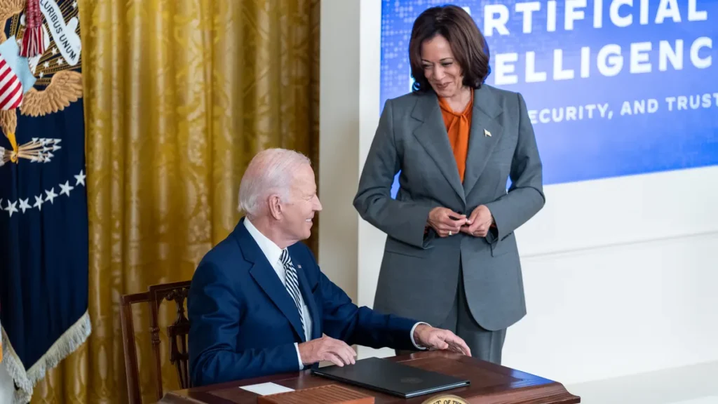 President Biden signing the AI security executive order in the White House East Room