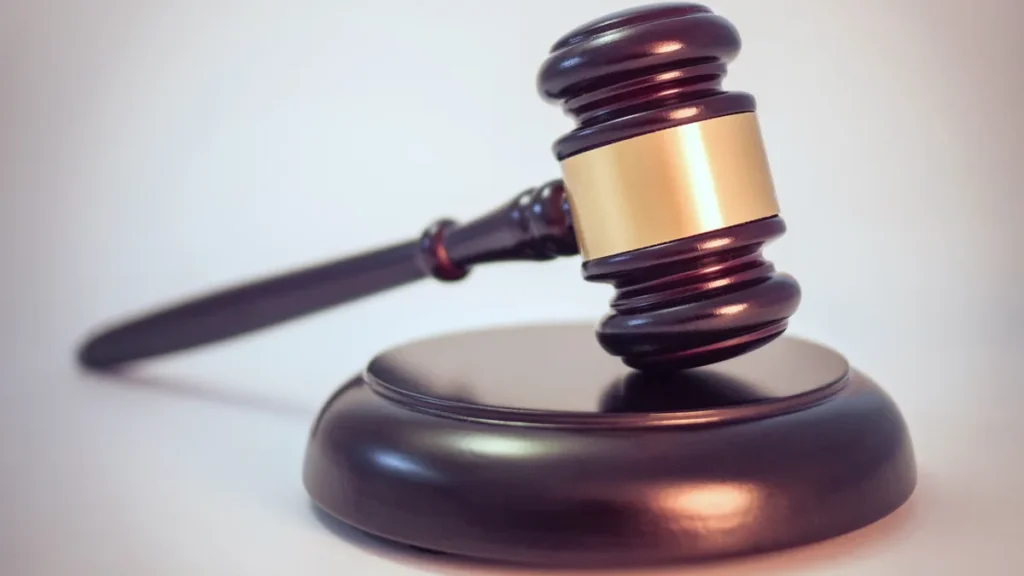 Wooden gavel on court document symbolizing judicial authority in federal election worker protection ruling