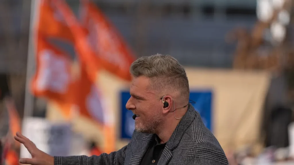 Broadcaster Pat McAfee speaking during a public appearance.
