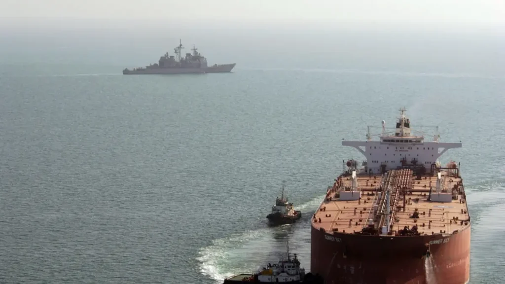 Super oil tanker guided into Al Basrah Oil Terminal in the Persian Gulf