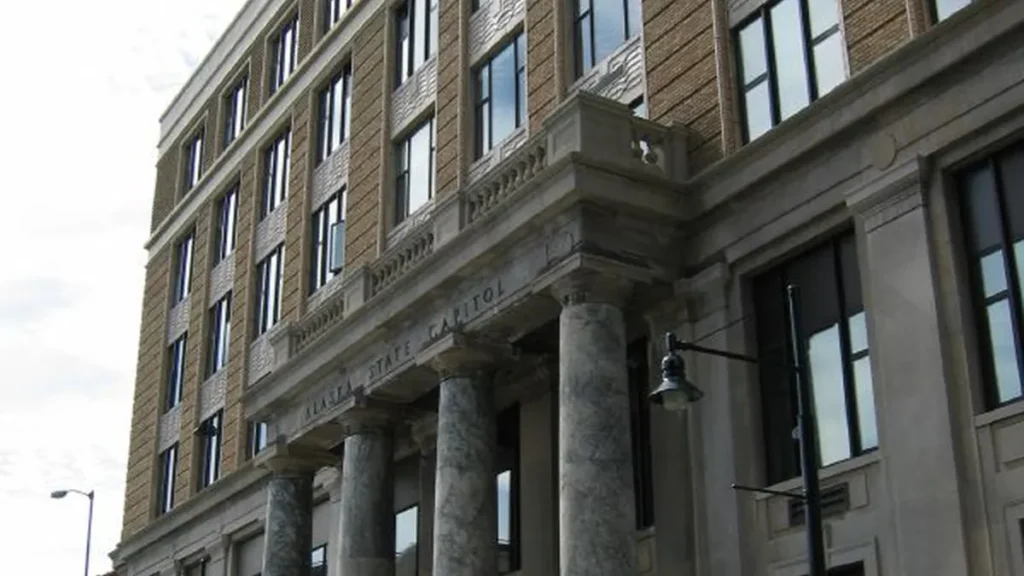 Exterior of the Alaska State Capitol building in Juneau under an overcast sky