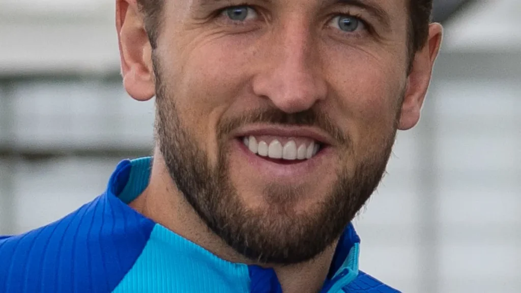 Professional football striker Harry Kane on the pitch during a competitive match.